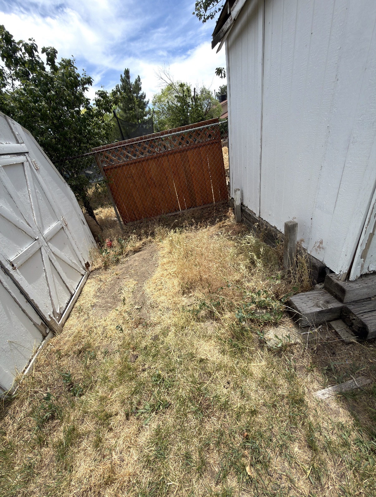Clean, cleared backyard after junk removal by Jay's Local Junk Removal